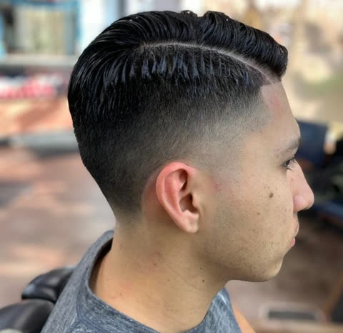 A side part over a mid fade